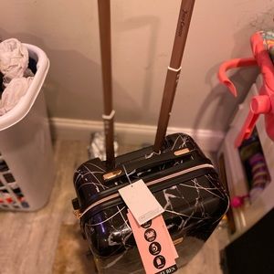 Juicy couture roll around luggage